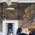 A cropped view of living room featuring a panoramic matte wallpaper mural of warm peach clouds
