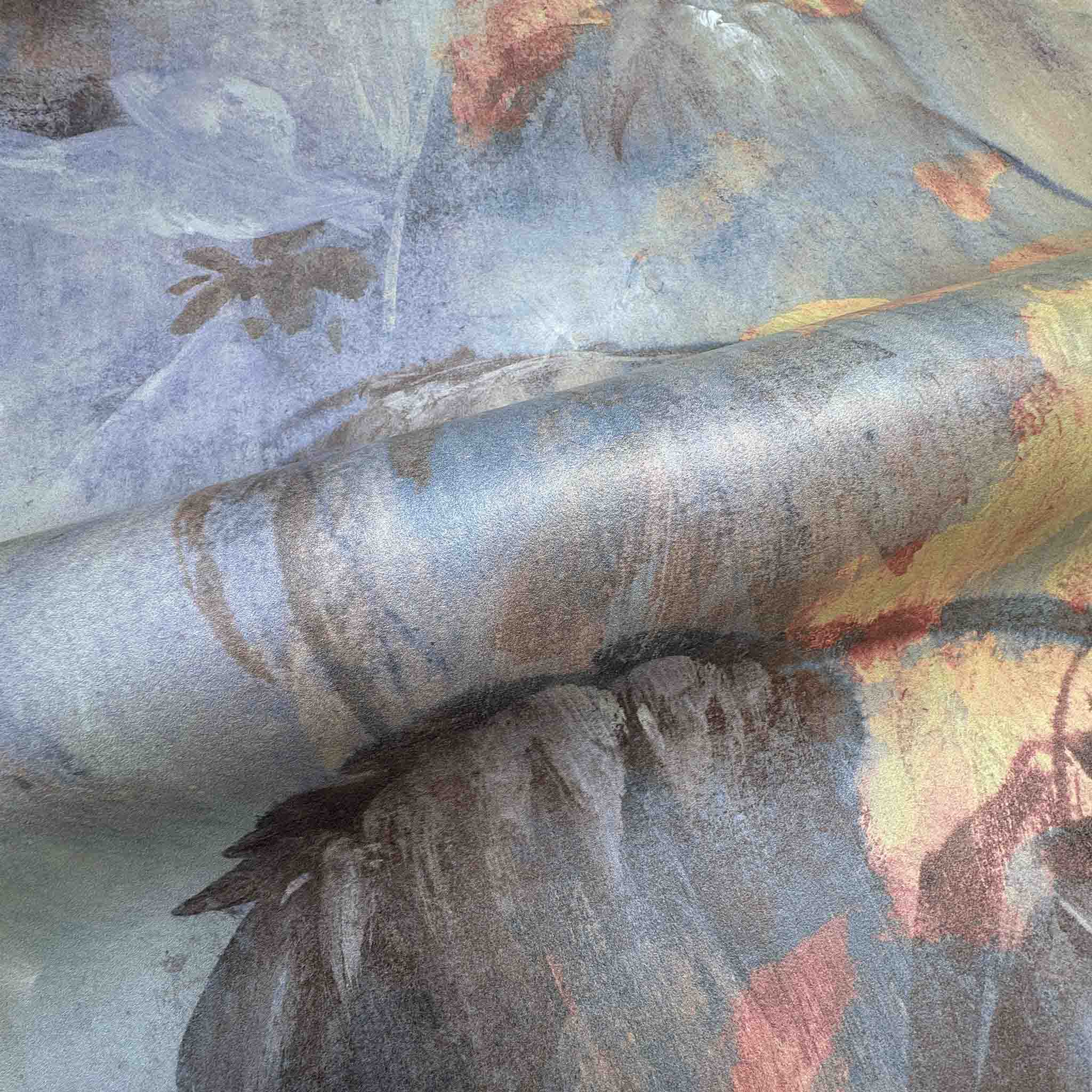 Close-up of bespoke panoramic wallpaper mural with tropical design in soft greys, dusty blues, and muted earth tones.