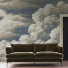 A cropped view of sitting area featuring a panoramic matte wallpaper mural of dramatic cream clouds