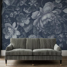 An interiorliving room featuring a panoramic matte wallpaper mural of moonlit florals on deep navy