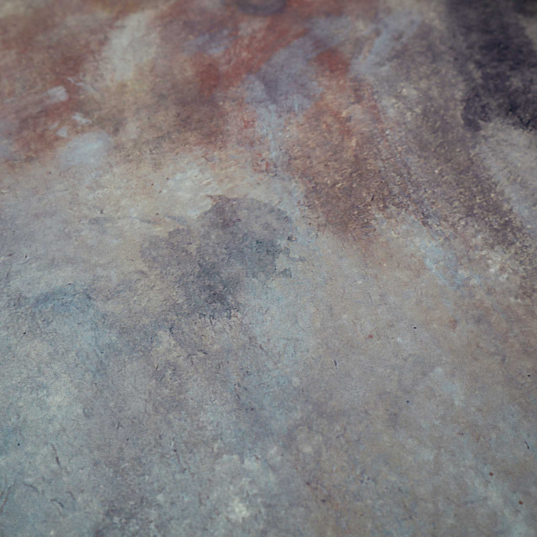 Close-up of a bespoke panoramic wallpaper mural in abstract tones of charcoal, rust, and ochre with a matte finish.