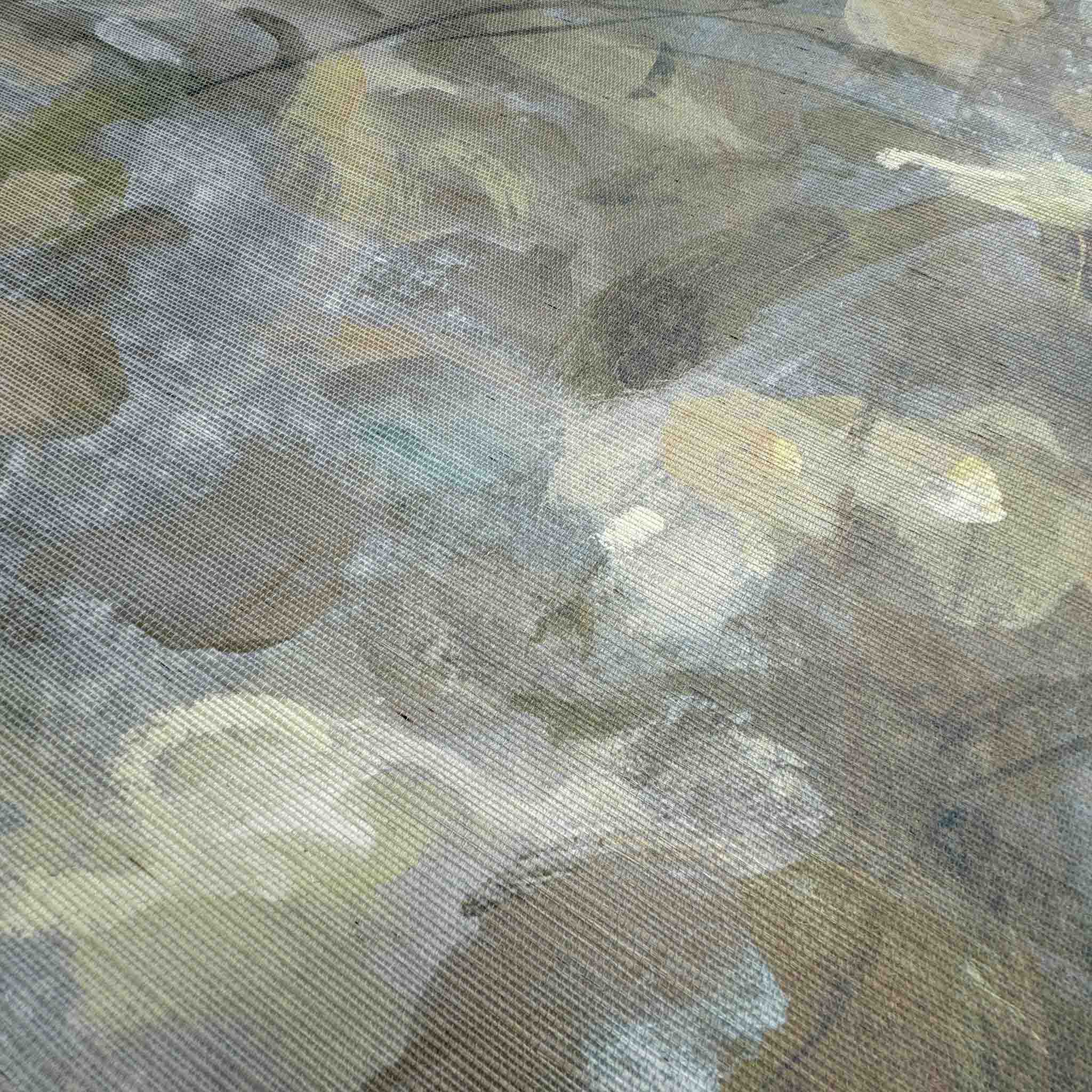 Close-up of a bespoke panoramic wallpaper mural featuring soft opal and lavender hues with a textured grasscloth finish.