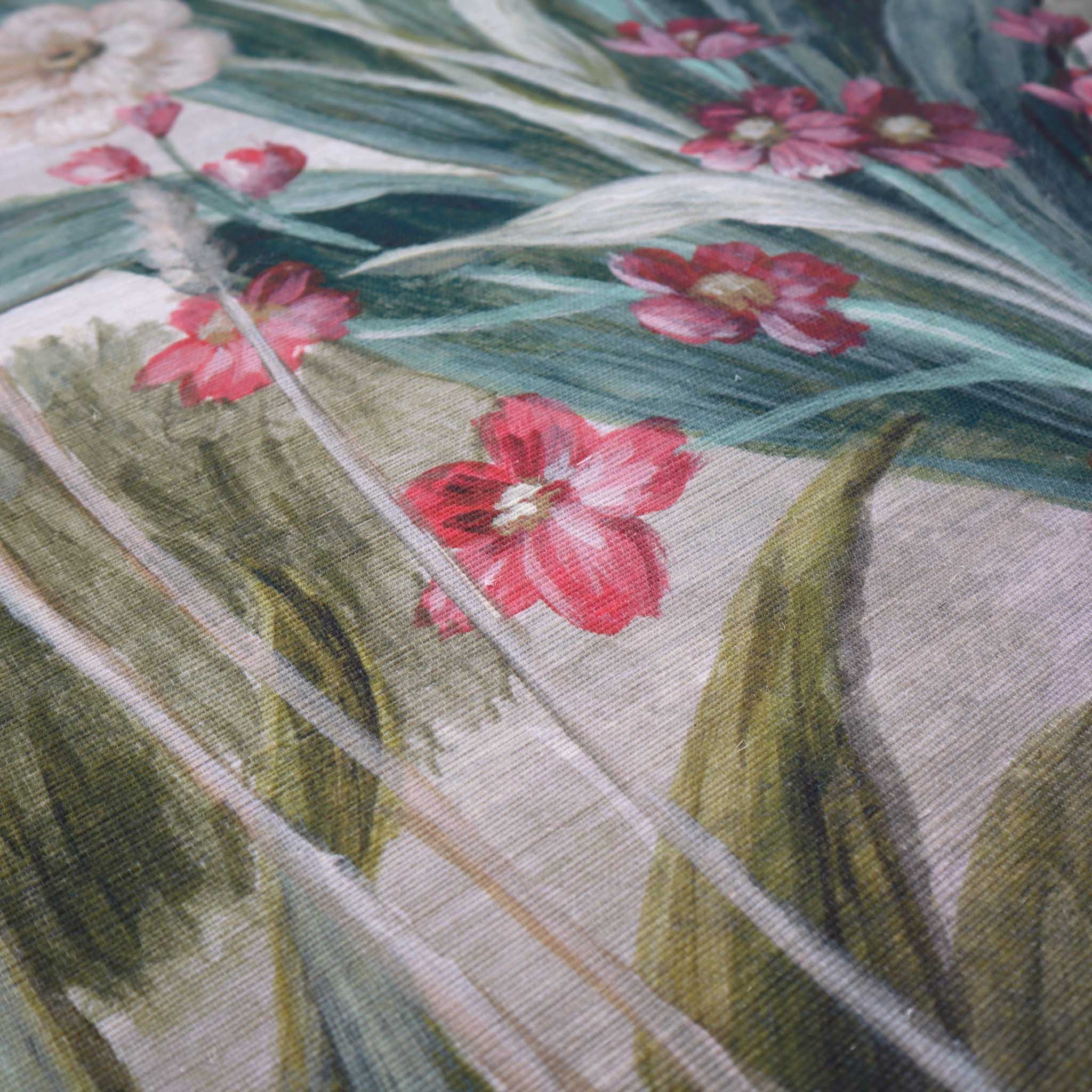 Close-up of a hand-painted floral wallpaper mural with vibrant pink flowers and green foliage on textured grasscloth.