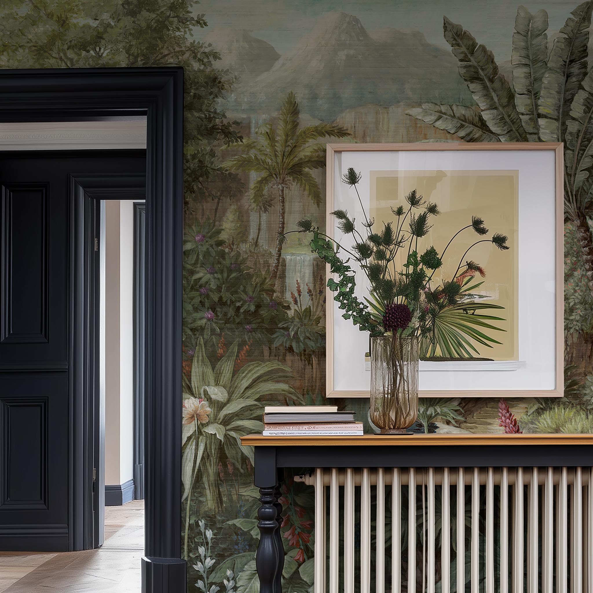 A cropped view of hallway featuring a panoramic grasscloth wallpaper mural of a tropical scene in green and pink.
