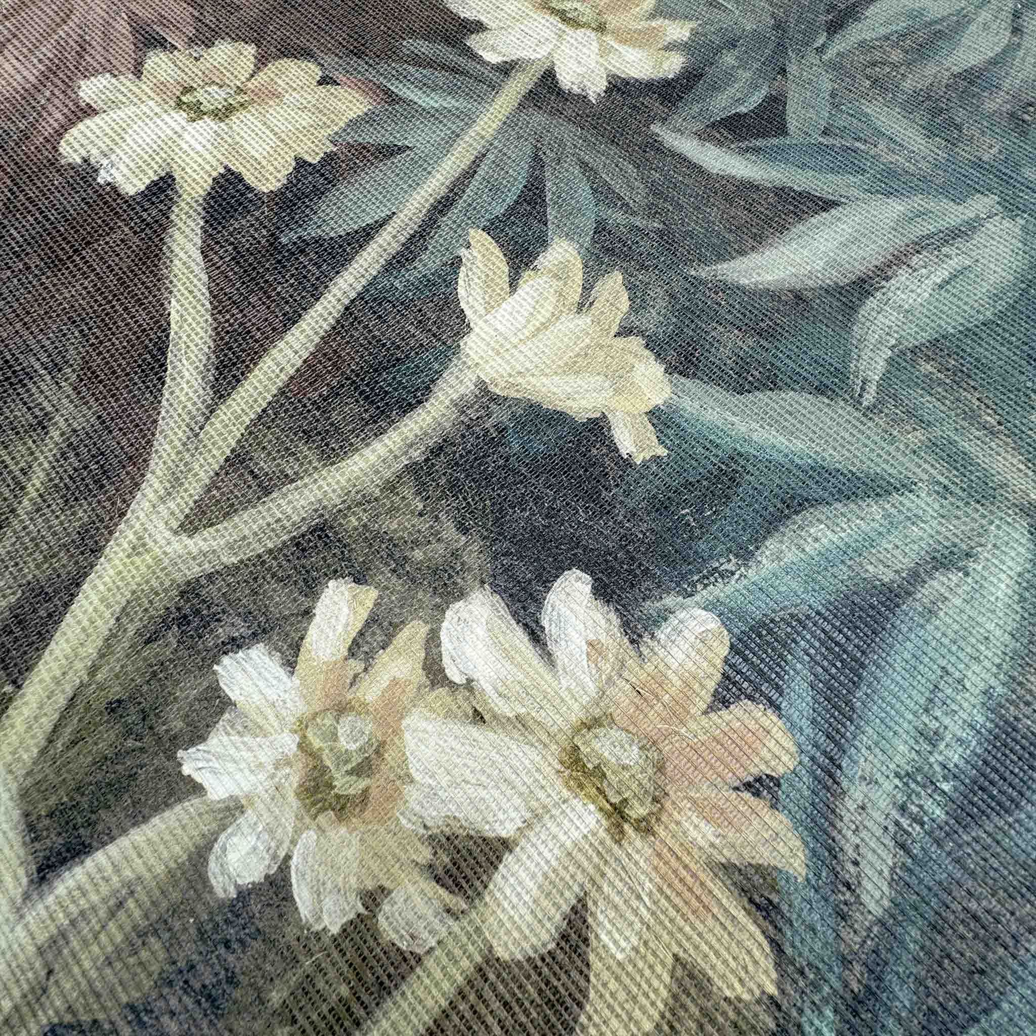 Close-up of a floral designer mural on grasscloth, featuring soft white flowers against a muted, textural background.