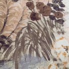 A close up view showing the detail of a grasscloth wallpaper mural which features a countryside in deep olive, slate and ash