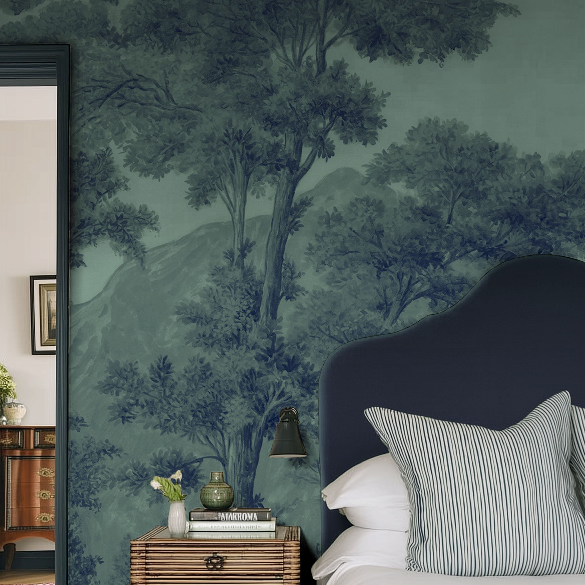 A cropped view of bedroom featuring a panoramic matte wallpaper mural of deep woodland