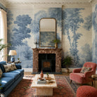 An interior living room featuring a panoramic grasscloth wallpaper mural of soft blue woodland
