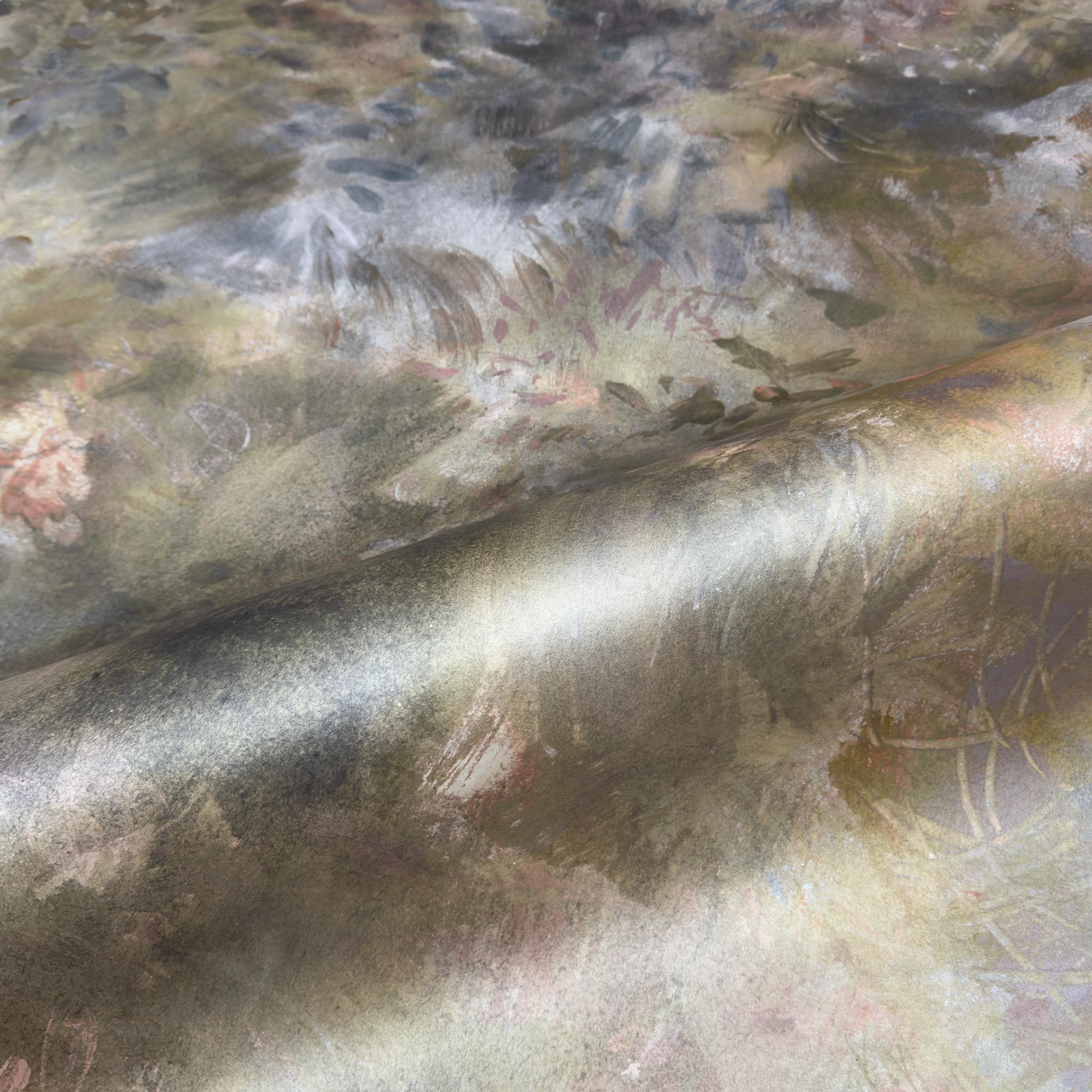 A close up view showing the detail of a pearlescent wallpaper mural which features muted botanical interior mural in shadow.